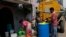 Residents of Ambedkar Nagar, a low-income settlement, collect potable water from a private tanker in Bengaluru, India, March 11, 2024. Water levels are running desperately low, particularly in poorer regions, resulting in sky-high costs for water and a quickly dwindling supply. 