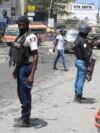 FILE - National Police patrol an intersection amid gang violence in Port-au-Prince, Haiti, April 8, 2024.