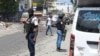 FILE - National Police patrol an intersection amid gang violence in Port-au-Prince, Haiti, April 8, 2024.