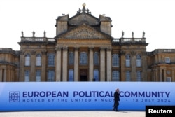 A person walks next to Blenheim Palace on the day of the European Political Community meeting, near Oxford, England, on July 18, 2024.