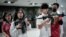 Students learn how to use an airsoft gun from Taiwanese military instructors at Kaohsiung Municipal Sanmin Senior High School in Kaohsiung, South Korea, Jan. 11, 2024. 
