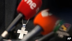 FILE - A crucifix is seen at a Feb. 22, 2022, press conference in Madrid, Spain, about sexual abuse and the Catholic Church. A report released Oct. 25, 2023, says as many as 400,000 victims may have endured sexual abuse from Spain’s clergy and lay people.