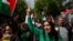 People gather in Paris to take a stand against racism, Islamophobia and violence against children, April 21, 2024. Some participants wore shirts that said "Free Palestine."