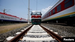 FILE - Trains are seen at Andode train station in Oromia region during a media guided tour of the Ethio-Djibouti Railways route in Adama, Ethiopia, Sept. 24, 2016.