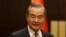 FILE - Chinese Foreign Minister Wang Yi poses as he meets Turkish Foreign Minister Hakan Fidan (not seen) in Ankara, July 26, 2023.