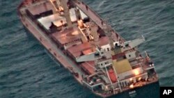 This photo made available by India's Press Information Bureau shows the Maltese-flagged MV Ruen. The Indian Navy said Saturday it is shadowing a bulk carrier that was boarded by unknown attackers in the Arabian Sea.
