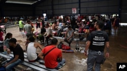 Migrants from Venezuela wait for transportation to continue on their way north to Nicaragua and hopefully to the Mexico-United States border, at a Migrant Temporal Attention Center in Paso Canoas, Costa Rica, Oct. 16, 2023. 