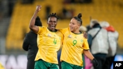 South Africa's Noko Matlou, left, and Gabriela Salgado celebrate after the Women's World Cup Group G soccer match between South Africa and Italy in Wellington, New Zealand, Aug. 2, 2023. Players who reached the World Cup's knockout round got bonuses that could be life-changing.