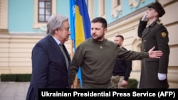 This handout picture taken and released by Ukrainian Presidential Press Service on March 8, 2023, shows Ukrainian President Volodymyr Zelenskyy, right, welcoming Secretary-General of the United Nations Antonio Guterres, in Kyiv, Ukraine.