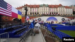 Preparations are made ahead of a speech by President Joe Biden at the Royal Castle Arcades, in Warsaw, Poland, Feb. 21, 2023.