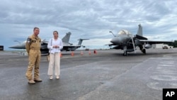 French air force Brig. Gen. Guillaume Thomas and French Ambassador Marie Fontanel stand in front of Rafale fighter jets at an annual French air force mission called Pagase takes place at Clark air base, in Pampanga Province, July 28, 2024. 