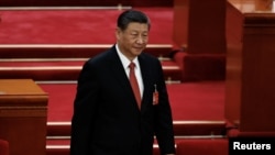 Chinese President Xi Jinping arrives for the closing session of the National People's Congress (NPC) at the Great Hall of the People in Beijing, March 11, 2024. 
