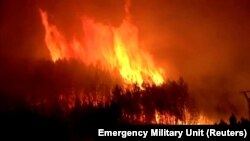 A fire burns in Pinofranqueado, Spain, May 18, 2023, in this screen grab taken from a handout video from the Emergency Military Unit. (Emergency Military Unit/Reuters)