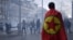 FILE - A protester wears a Kurdistan Workers' Party flag on his shoulders during clashes that followed a demonstration of support for the Kurdish community, a day after a gunman killed three people at a Kurdish cultural center, in Paris, Dec. 24, 2022.