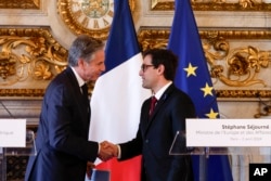 U.S. Secretary of State Antony Blinken (L) shakes hands with French Foreign Minister Stephane Séjourna during a joint press conference at the Ministry of Foreign Affairs in Paris, France, April 2, 2024.