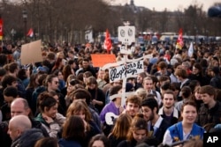 Protesters gather at Concorde square near the National Assembly in Paris, Thursday, March 16, 2023.