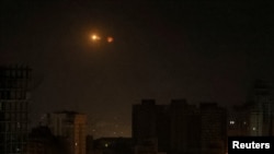 An explosion of a drone is seen in the sky over the city during a Russian drone strike, amid Russia's attack on Ukraine, in Kyiv, Ukraine May 25, 2023.