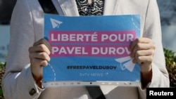 A protester holds a placard to bring attention to the arrest of Pavel Durov, founder and CEO of the Telegram messaging app, near the French Embassy in Moscow, Russia, Aug 25, 2024. The placard reads: 