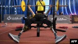 A weightlifter warms up during the qualifying round of the Ukrainian Invictus Games, in Lviv, Ukraine, on April 29, 2023. Qualifying competition winners will represent Ukraine at the Invictus Games in September in Dusseldorf, Germany.