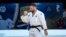 FILE - Arman Adamian of Russia celebrates a win during the men's - 100kg final match at the Grand Slam Paris 2021 Judo tournament, in Paris, France, Oct. 17, 2021.