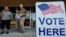 Voters depart an election center during primary voting, in Kennesaw, Georgia, May 21, 2024. 