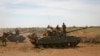 FILE - Ethiopian military tanks sit on the outskirts Baidoa in Somalia, Feb. 29, 2012. Somalia said Aug. 23, 2024, that Ethiopian forces would not be part of the upcoming African Union mission in Somalia unless Ethiopia cancels a deal it signed with Somaliland earlier this year.