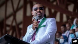 FILE - Ethiopia's Prime Minister Abiy Ahmed speaks at a stadium in the town of Jimma in the southwestern Oromia region of Ethiopia, June 16 2021. On Sunday, Abiy announced his government will begin negotiations with the Oromo Liberation Army rebel group.