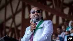 FILE - Ethiopia's Prime Minister Abiy Ahmed speaks at a stadium in the town of Jimma in the southwestern Oromia region of Ethiopia, June 16 2021. On Sunday, April 23, 2023, Abiy announced his government will begin negotiations with the Oromo Liberation Army rebel group.
