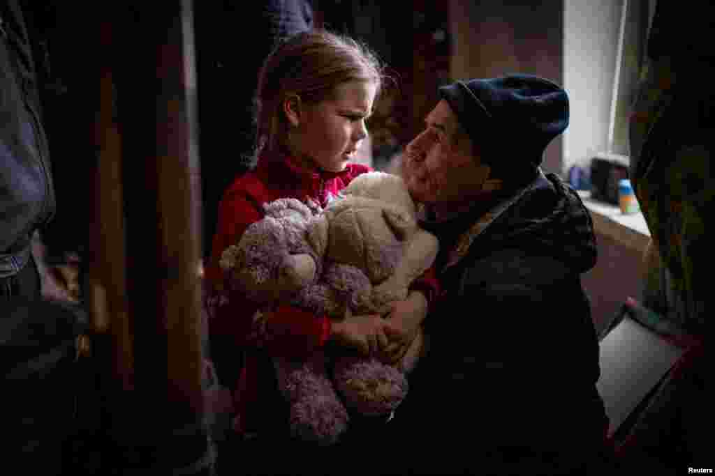 A grandfather says goodbye to his granddaughter Arina, 6, before her evacuation from front line city of Bakhmut, amid Russia&#39;s attack on Ukraine, in Donetsk region, Ukraine, Jan. 31, 2023.&nbsp;Arina is one of an estimated 11 million people displaced by the war in Ukraine, according to U.N. figures, that began when Russia invaded in February 2022.&nbsp;The grandparents initially said they did not want the little girl to leave - but eventually concluded it would be for the best.&nbsp;