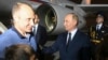 Russian President Vladimir Putin, right, greets Artem Dultsev, left, upon arrival of freed Russian prisoners at Vnukovo government airport outside Moscow, Aug. 1, 2024. (Mikhail Voskresensky, Sputnik, Kremlin pool photo via AP)