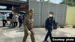 Deputy Commissioner of the Royal Thai Police, Pol. Gen. Surachate Hakparn walks to investigate the raid of the Jinling entertainment venue in Bangkok’s Yannawa district.