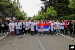 FILE - People attend a protest rally in front of the city hall in the town of Zvecan, Kosovo, May 31, 2023. Hundreds of ethnic Serbs began gathering in front of the city hall in repeated efforts to take over the offices where ethnic Albanian mayors took up their posts last week.