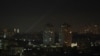 Ukrainian servicemen use a searchlight as they search for drones in the sky over the city during a Russian drone strike, amid Russia's attack on Ukraine, in Kyiv, Ukraine May 19, 2023.