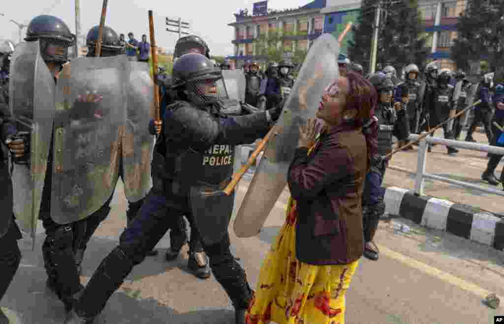 Policemen baton charge supporters of Rastriya Prajatantra Party, or national democratic party during a protest demanding a restoration of Nepal&#39;s monarchy in Kathmandu.