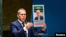 FILE - Israel's Ambassador to the United Nations Gilad Erdan holds a picture of Palestinian Islamist group Hamas' leader in Gaza Yahya Sinwar, as he addresses delegates during the United Nations General Assembly in New York City, May 10, 2024.