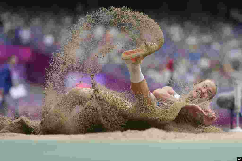 Uzbekistan&#39;s Ekaterina Voronina competes during the women&#39;s heptathlon long jump at the 19th Asian Games in Hangzhou, China.