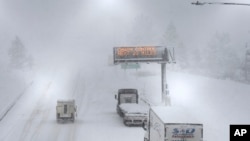A lone camper truck moves north on Interstate 80 at the Donner Pass Exit, March 1, 2024, in Truckee, California. The most powerful Pacific storm of the season was forecast to bring up to 10 feet of snow into the Sierra Nevada by the weekend.