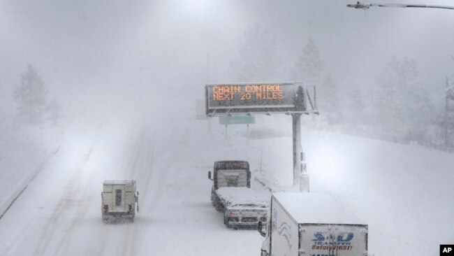 A lone camper truck moves north on Interstate 80 at the Donner Pass Exit, March 1, 2024, in Truckee, Calif. The most powerful Pacific storm of the season was forecast to bring up to 10 feet of snow into the Sierra Nevada by the weekend.
