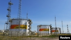 FILE - Fuel tanks are seen at a facility owned by Russia's Rosneft energy company outside the town of Neftegorsk in the Samara region, Russia, Sept. 1, 2023.