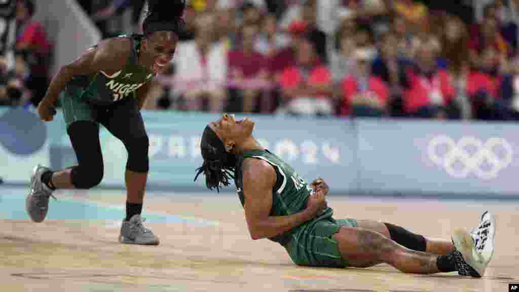 Ezinne Kalu (23), and Promise Amukamara (10) of Nigeria celebrate in a women&#39;s basketball game against Canada at the 2024 Summer Olympics in Villeneuve-d&#39;Ascq, France.