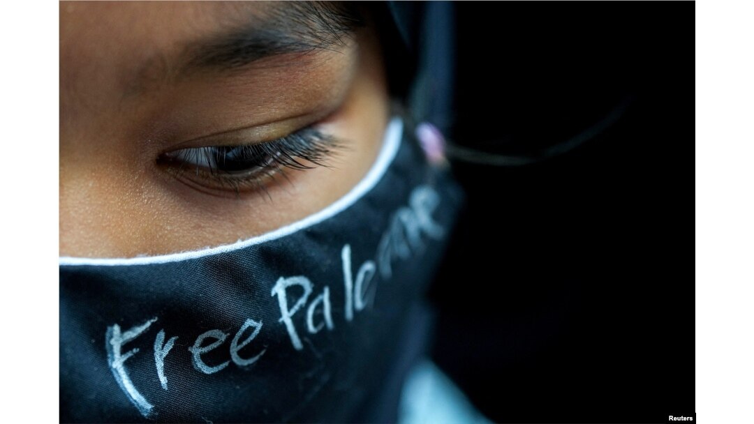 A person participates in a pro-Palestinian rally in front of the Israeli Embassy in Bangkok, Oct. 21, 2023.