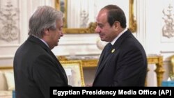 Egyptian President Abdel Fattah el-Sissi, right, greets United Nations Secretary-General Antonio Guterres during an international peace summit near Cairo, Oct. 21, 2023. (Egyptian Presidency Media Office via AP)