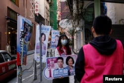 A volunteer campaigns for the New People's Party during the District Council election in Hong Kong, China, Dec. 10, 2023.