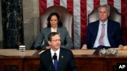 Israeli President Isaac Herzog speaks at a joint meeting of Congress, at the Capitol in Washington, July 19, 2023, as Vice President Kamala Harris and House Speaker Kevin McCarthy look on. 