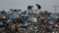 Palestinians look through garbage, amid the ongoing conflict between Israel and Palestinian Islamist group Hamas, in Rafah, southern Gaza Strip, Jan. 29, 2024.