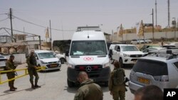 An ambulance rushes out of a military base following a deadly shootout in southern Israel along the Egyptian border, June 3, 2023.