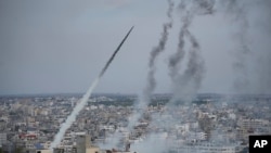 Rockets are launched by Palestinian militants from the Gaza Strip towards Israel on Oct. 7, 2023.