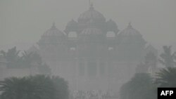 The Akshardham temple is seen amid heavy smog in New Delhi on Nov, 9, 2023. 