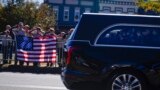 Boy scouts salute as the hearse moves during the funeral service for former first lady Rosalynn Carter in Plains, Georgia, Nov. 29, 2023.