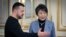 In this photo provided by the Ukrainian Presidential Press Office, Ukrainian President Volodymyr Zelenskyy, left, greets Japan's Foreign Minister Yoko Kamikawa in Kyiv, Ukraine, Jan. 7, 2024. 